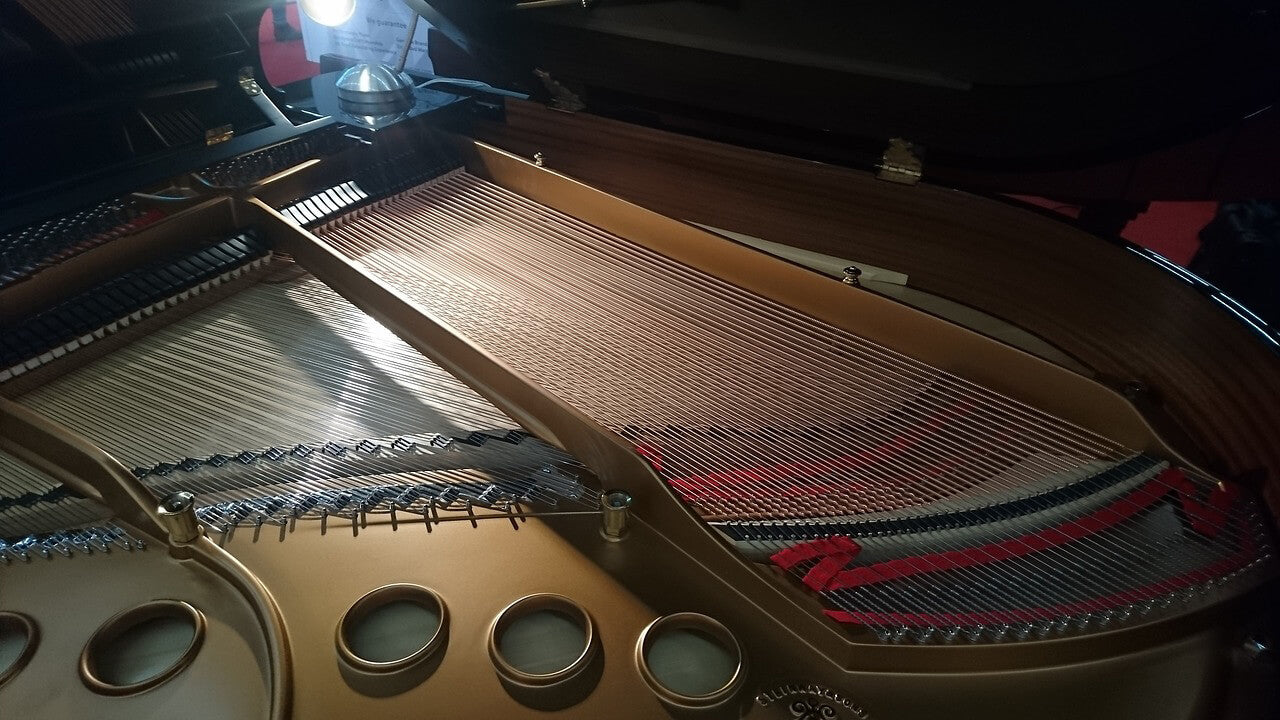 Internal components of a grand piano without lid cover