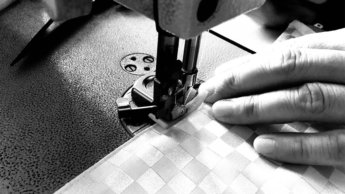 Tailor sewing a universal keyboard & digital piano cover