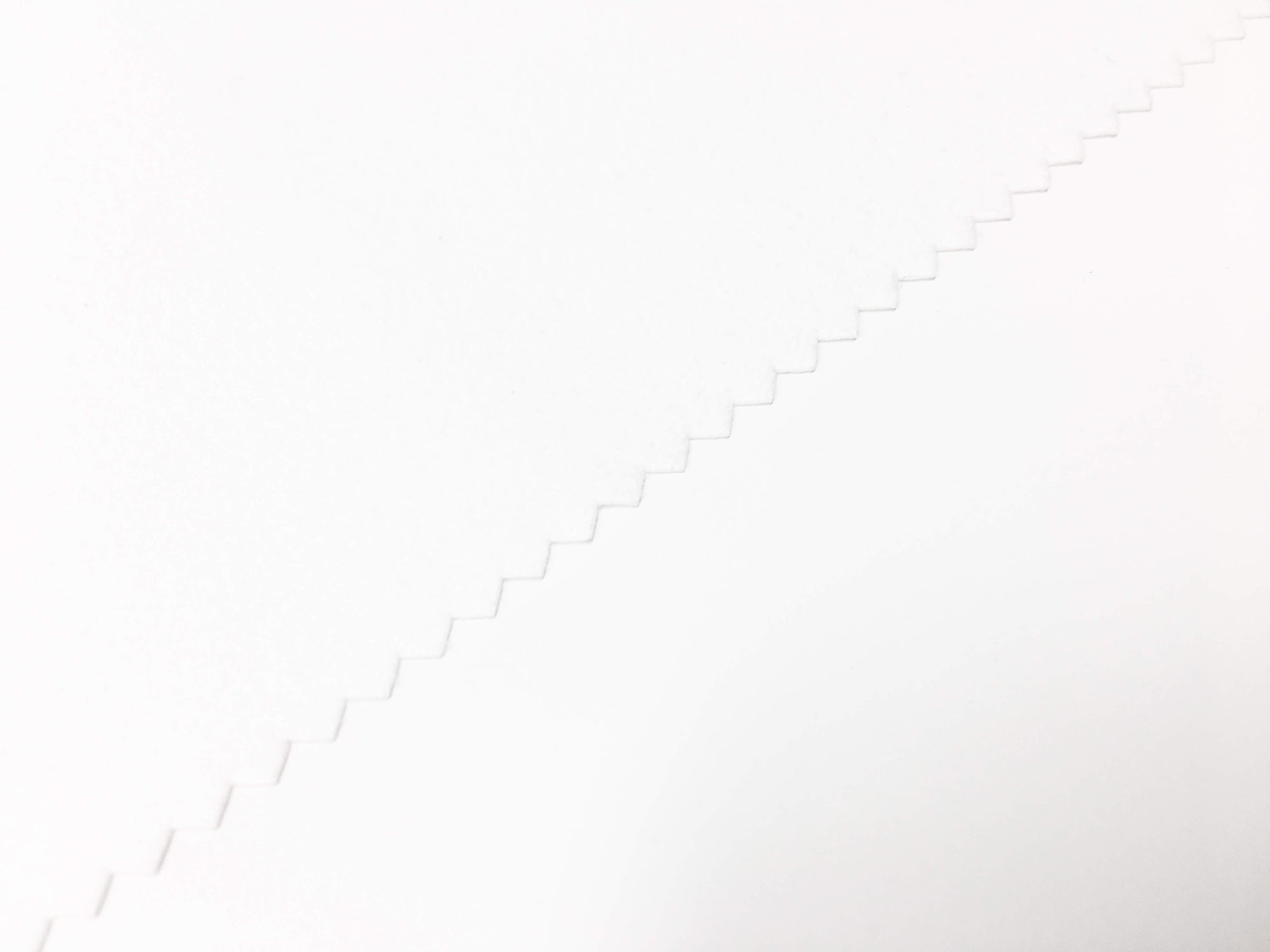 close up of a piano key cover in white